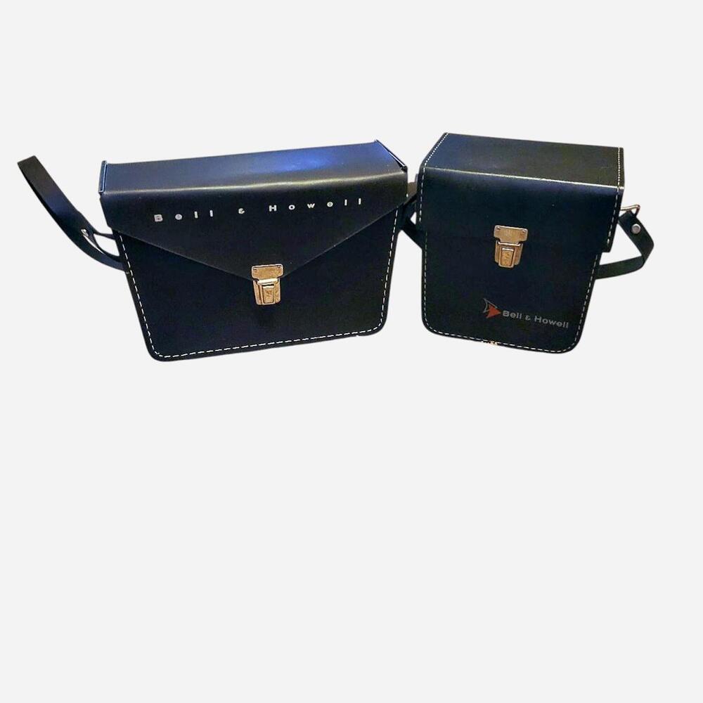 Vintage Bell & Howell black leather camera cases with white accent stitches